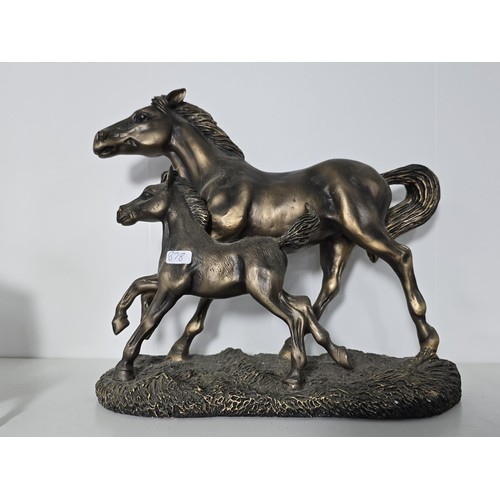 93 - A quantity of Horse figurines to include Horse and foal by the Leonardo collection resin figure a pa... 