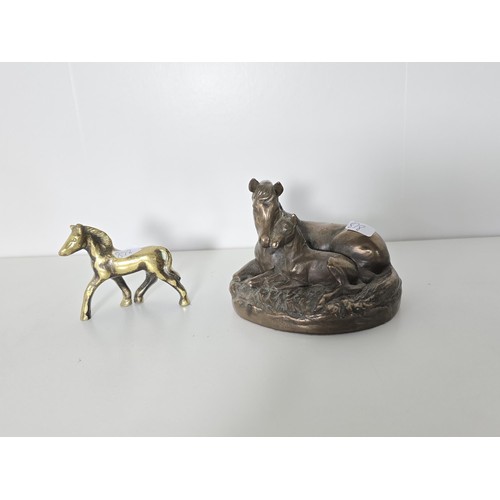 93 - A quantity of Horse figurines to include Horse and foal by the Leonardo collection resin figure a pa... 