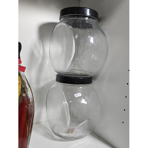 102 - 3x decorative vinegar infused fruit and vegetable bottles along with 3x empty glass kitchen storage ... 