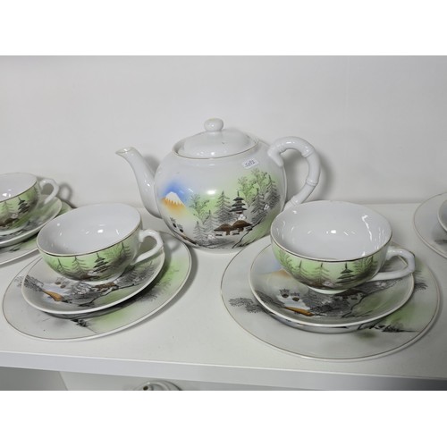 95 - Unity part tea set in a Japanese landscape design comes complete with teapot, lidded sugar bowl and ... 