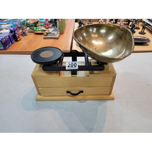 200 - Set of modern cast iron weighing scales by Salter, on a wooden plinth with drawer to the base, drawe... 