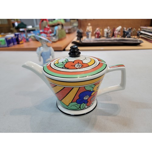 203 - Past Times Clarice Cliff inspired teapot in an art deco design titled Bizarre Ware, along with a por... 