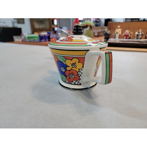 203 - Past Times Clarice Cliff inspired teapot in an art deco design titled Bizarre Ware, along with a por... 