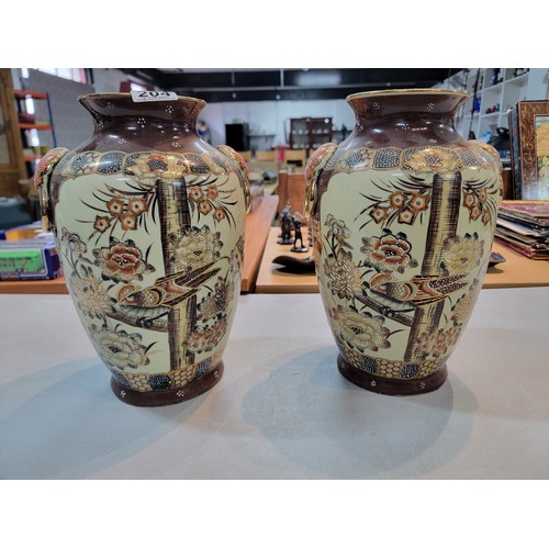 204 - 2x Antique Japanese satsuma vases, hand painted with a bird design and flower shaped handles, with g... 