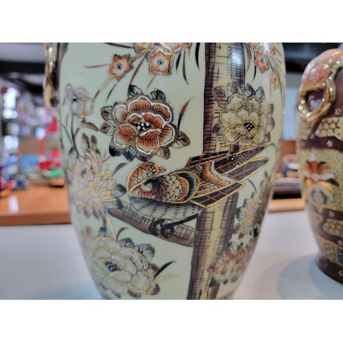 204 - 2x Antique Japanese satsuma vases, hand painted with a bird design and flower shaped handles, with g... 