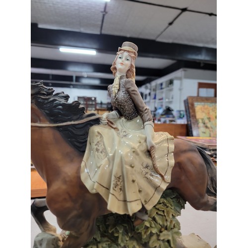 205 - A Large good quality Capodimonte signed horse figure with lady rider in good order height of 35cm le... 