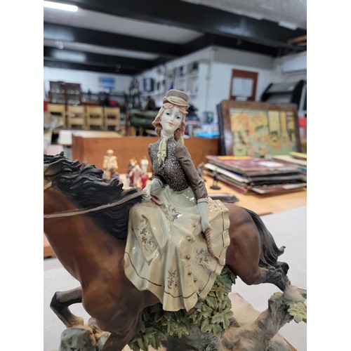 205 - A Large good quality Capodimonte signed horse figure with lady rider in good order height of 35cm le... 