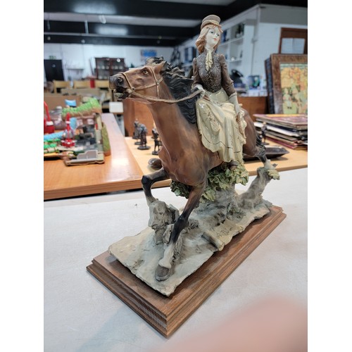 205 - A Large good quality Capodimonte signed horse figure with lady rider in good order height of 35cm le... 