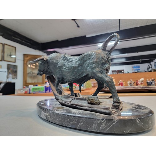 207 - Large bronze cast bull on a marble plinth very well executed depicting a fighting bull standing on a... 