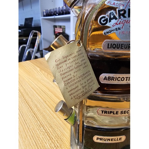 104 - A very rare vintage new and sealed Garnier liqueurs quadrille bottle stacking set from the 1950's wh... 