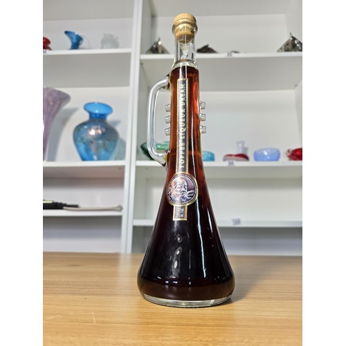 109 - A new and sealed vintage bottle of 500ml toffee liqueur dream in a trumpet formed bottle in tribute ... 