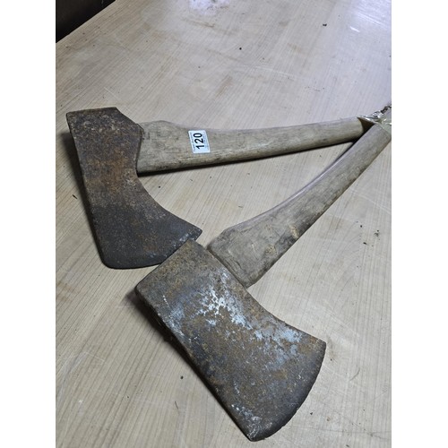 120 - 2 good vintage heavy duty axes, both complete with handles which are in good order, the axe heads ma... 