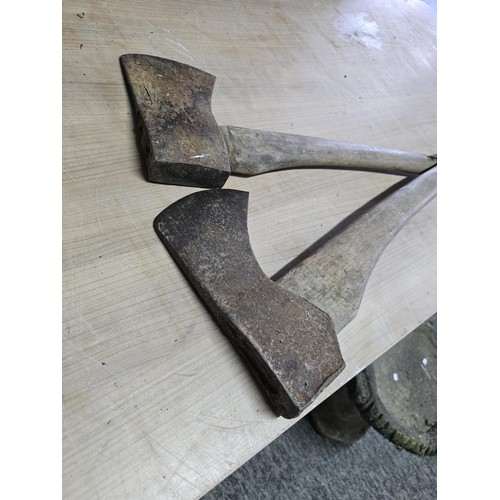 120 - 2 good vintage heavy duty axes, both complete with handles which are in good order, the axe heads ma... 