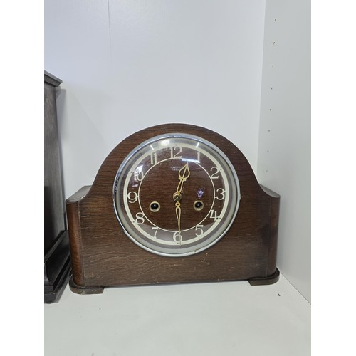 107 - 2x good vintage mantel clocks along with a pair of vintage shoe shapers and historical headlines new... 