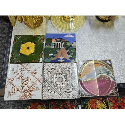 108 - A collection of amber glass and collectable tiles which includes a vintage hand blown Murano amber g... 