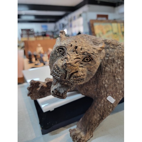 220 - Good quality solid wooden hand carved figure of a Puma / Mountain Lion, well executed, has a small s... 