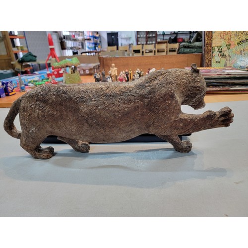 220 - Good quality solid wooden hand carved figure of a Puma / Mountain Lion, well executed, has a small s... 