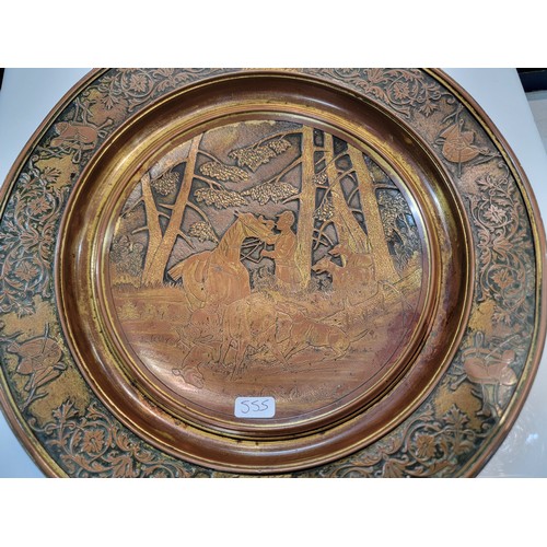 221 - Vintage metal dish with bronze effect depicting a hunting boar scene to the centre with horse relate... 