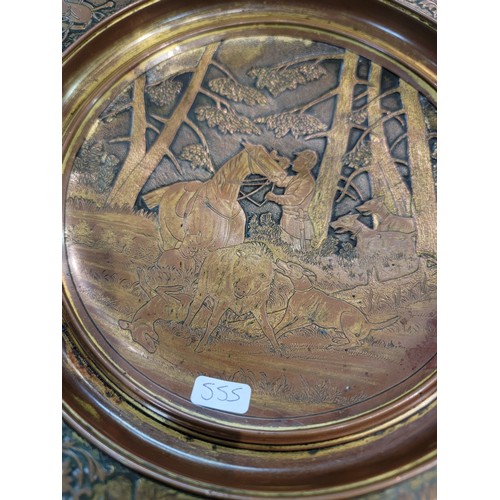 221 - Vintage metal dish with bronze effect depicting a hunting boar scene to the centre with horse relate... 