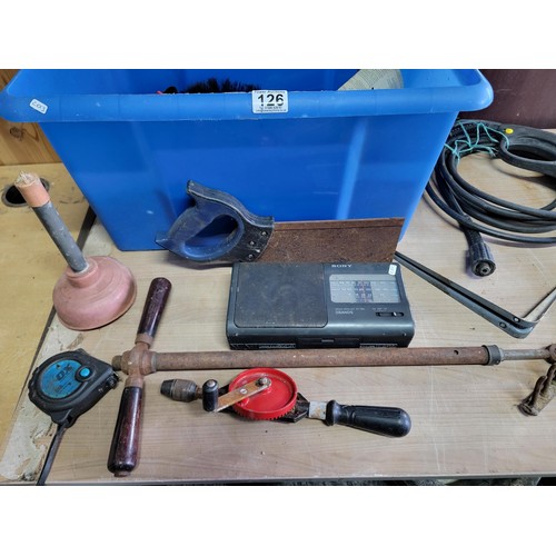 126 - Large blue crate containing a large quantity of shed odds inc hand held drill, sony portable radio, ... 