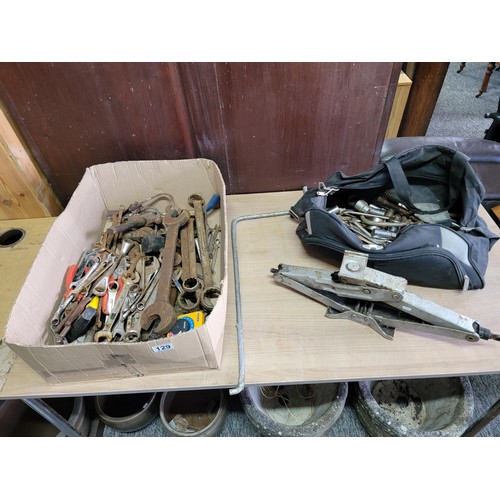 129 - Box of large spanners along with a vehicle jack, along with holdall bag of spanners & sockets etc.