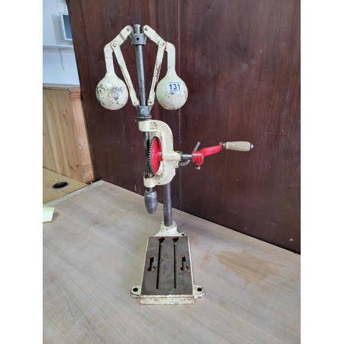 131 - Good quality vintage pillar drill with weighted top in good order with a height of 70cm