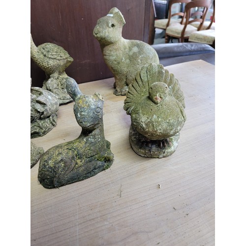 134 - Collection of concrete garden figures inc a hatching duck, gnome, dog, cat, sitting fawn, hare etc, ... 