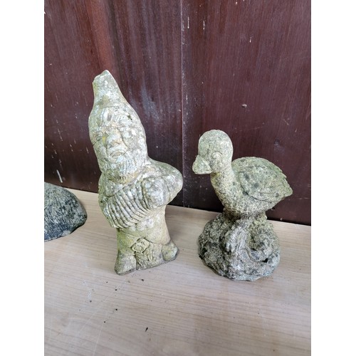 134 - Collection of concrete garden figures inc a hatching duck, gnome, dog, cat, sitting fawn, hare etc, ... 