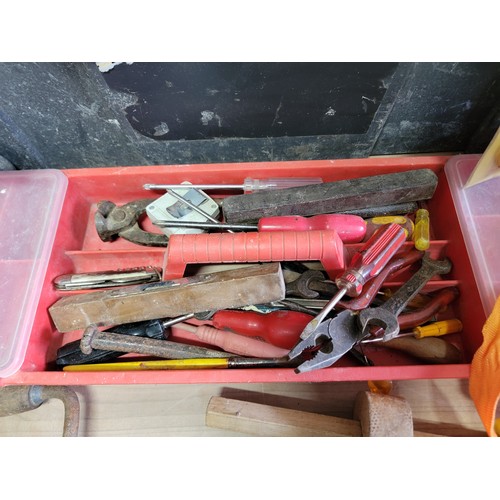 135 - 2x tool boxes full of a selection of tools inc hammers, belly drill, pliers, screwdrivers, a job lot... 