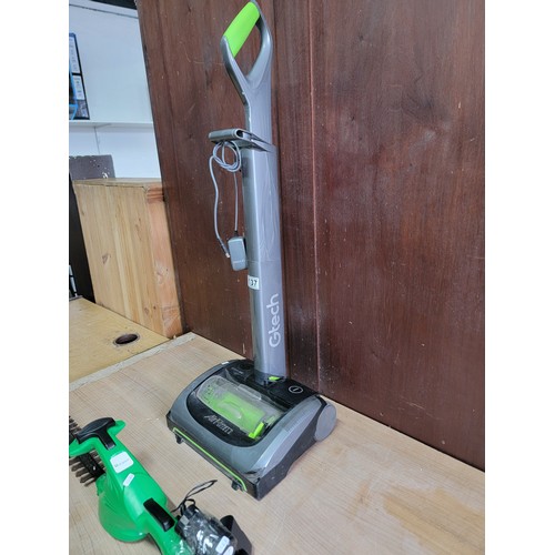 137 - Green verigreen hedge trimmer with battery along with a G-tech air ram vacuum cleaner with power cab... 