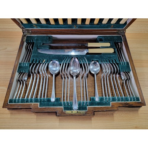 225 - A comprehensive Art Deco oak cased canteen of cutlery for 6 places carving fork is missing otherwise... 