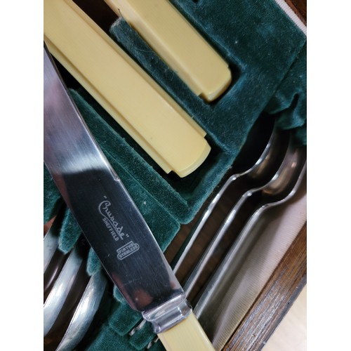 225 - A comprehensive Art Deco oak cased canteen of cutlery for 6 places carving fork is missing otherwise... 