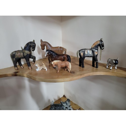 232 - A collection of horse and dog figures to include a well crafted leather wrapped rearing horse, 2 sol... 