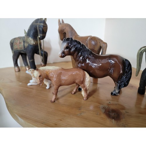 232 - A collection of horse and dog figures to include a well crafted leather wrapped rearing horse, 2 sol... 