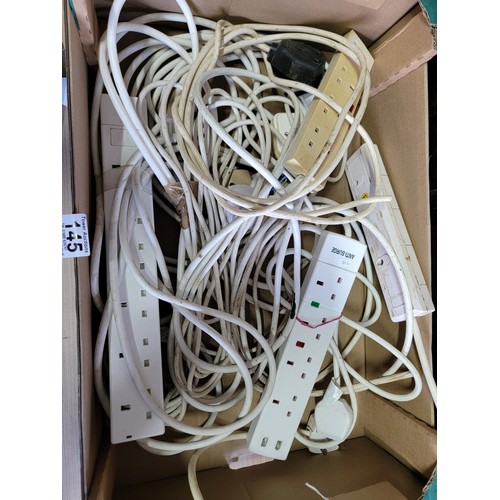 145 - Box containing a quantity of electrical extension cables along with a Makita electric drill