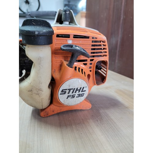 157 - Stihl FS 38 Petrol strimmer with good compression complete with protection guard