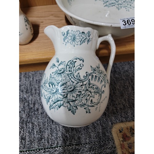 369 - Vintage jug and bowl set along with a addition of a vase, all have a matching pale coloured blue flo... 