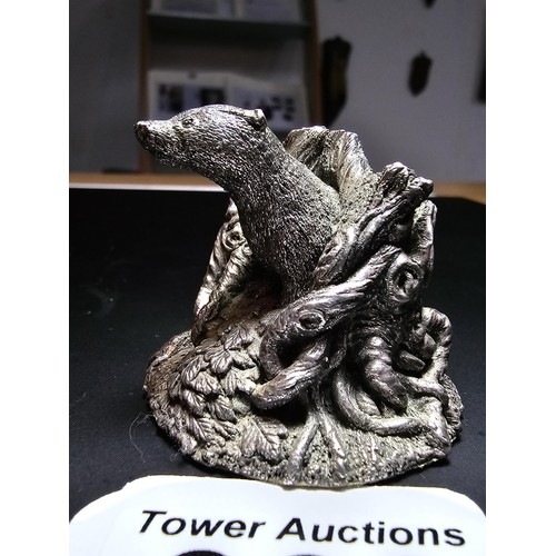 338 - A hallmarked silver badger figure coming out of a tree stump by Country Artists, also signed to the ... 