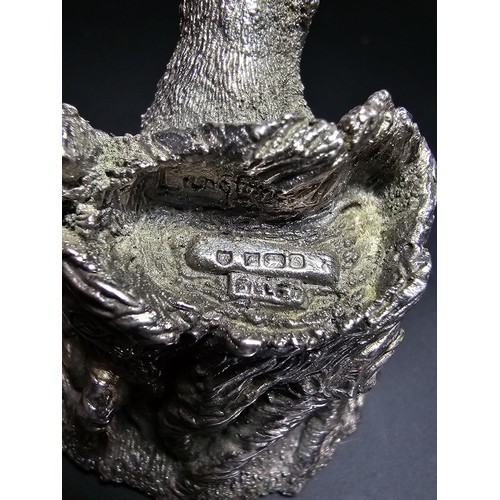 338 - A hallmarked silver badger figure coming out of a tree stump by Country Artists, also signed to the ... 