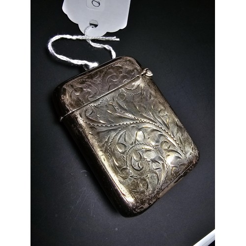 339 - A hallmarked silver antique vesta case featuring an engraved design having a shield cartouche to the... 