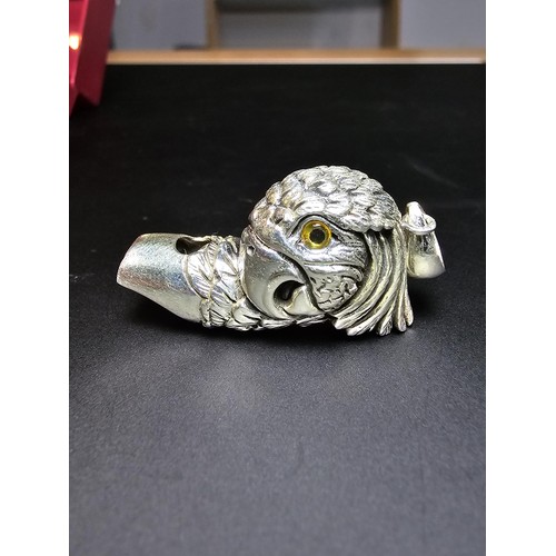 340 - A stunning sterling silver parrot head formed whistle featuring yellow glass eyes, beautifully cast ... 