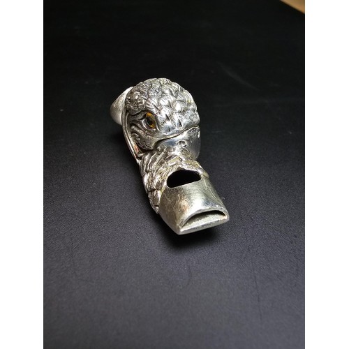 340 - A stunning sterling silver parrot head formed whistle featuring yellow glass eyes, beautifully cast ... 