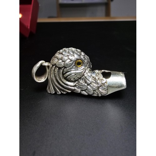 340 - A stunning sterling silver parrot head formed whistle featuring yellow glass eyes, beautifully cast ... 