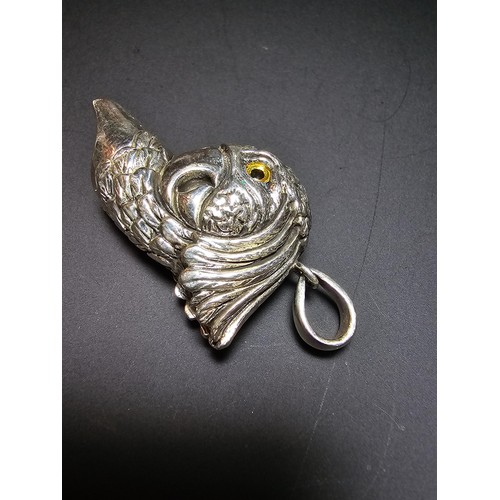 340 - A stunning sterling silver parrot head formed whistle featuring yellow glass eyes, beautifully cast ... 