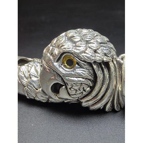 340 - A stunning sterling silver parrot head formed whistle featuring yellow glass eyes, beautifully cast ... 