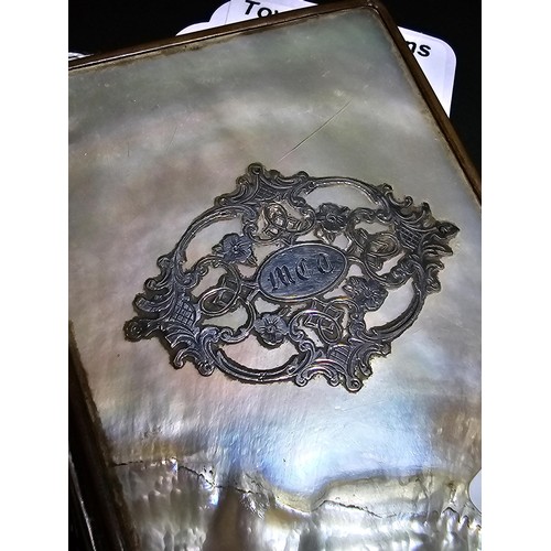 341 - A good quality antique mother of pearl cased notebook having an overlaid sterling silver cartouche t... 