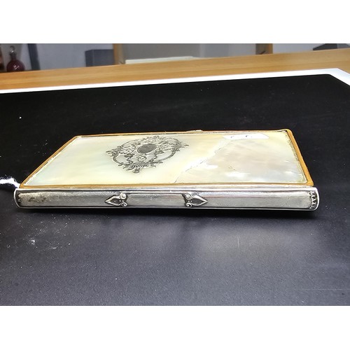 341 - A good quality antique mother of pearl cased notebook having an overlaid sterling silver cartouche t... 