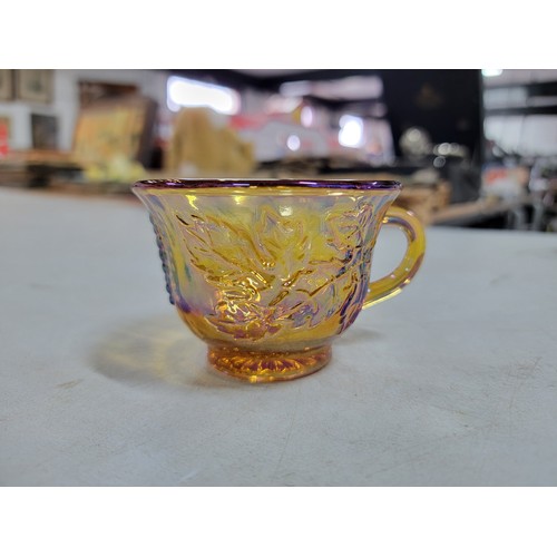 370 - Large collection of 12x carnival glass cups, all cups have a moulded leaf design to the sides, all i... 