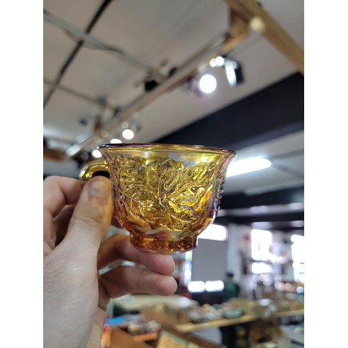 370 - Large collection of 12x carnival glass cups, all cups have a moulded leaf design to the sides, all i... 