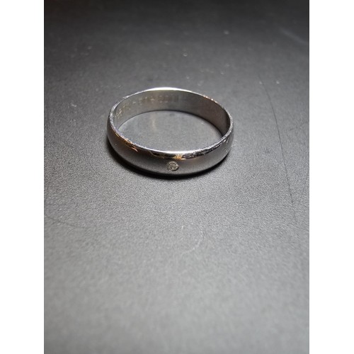 347 - A hallmarked 9ct white gold ring inset with a small genuine diamond inscribed inside 2 hearts- 1 sou... 